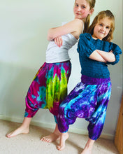 Load image into Gallery viewer, Emma's Emporium Tie dye vibrant colourful children's unisex comfy loose fit harem genie Alibaba afghani trousers for ages 1 year to 10 years, for toddlers and young children. Emma's Emporium online slow ethical alternative festival fashion.