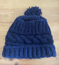 Load image into Gallery viewer, Buy now online from Emma's Emporium, Colourful Nepalese cable knit Pompom Bobble Hat! Keep your head warm this winter! Pure wool hand knitted hats in vibrant bold colours. Made for Emma's Emporium with love by our friends in Kathmandu.