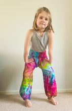 Load image into Gallery viewer, Emma's Emporium Tie dye vibrant colourful children's unisex comfy loose fit harem genie Alibaba afghani trousers for ages 1 year to 10 years, for toddlers and young children. Emma's Emporium online slow ethical alternative festival fashion.