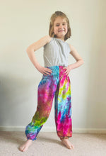Load image into Gallery viewer, Emma's Emporium Tie dye vibrant colourful children's unisex comfy loose fit harem genie Alibaba afghani trousers for ages 1 year to 10 years, for toddlers and young children. Emma's Emporium online slow ethical alternative festival fashion.