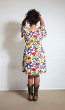Load image into Gallery viewer, Emma's Emporium bold floral print summer beach dress, with elastic back and pockets. Colourful lightweight summer beach festival dress!