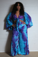 Load image into Gallery viewer, Emma's Emporium tie dye Palazzo trousers, extra wide leg flared hippy trousers with wide elastic waistband in bright vibrant tie dye. Made to ethical fair trade standards for Emma's Emporium slow fashion alternative women's festival clothing.