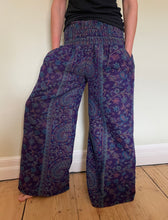 Load image into Gallery viewer, New In! Palazzo Pants! Emma's Emporium fleece genie harem trousers, loose fit warm winter hippy pants, made from machine washable vegan fleece, in bright flower or paisley design. Slow fashion, ethically sourced hippie festival hippy fashion.