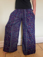 Load image into Gallery viewer, New In! Palazzo Pants! Emma's Emporium fleece genie harem trousers, loose fit warm winter hippy pants, made from machine washable vegan fleece, in bright flower or paisley design. Slow fashion, ethically sourced hippie festival hippy fashion.