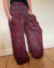 Load image into Gallery viewer, New In! Palazzo Pants! Emma's Emporium fleece genie harem trousers, loose fit warm winter hippy pants, made from machine washable vegan fleece, in bright flower or paisley design. Slow fashion, ethically sourced hippie festival hippy fashion.