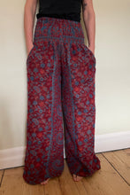 Load image into Gallery viewer, New In! Palazzo Pants! Emma's Emporium fleece genie harem trousers, loose fit warm winter hippy pants, made from machine washable vegan fleece, in bright flower or paisley design. Slow fashion, ethically sourced hippie festival hippy fashion.