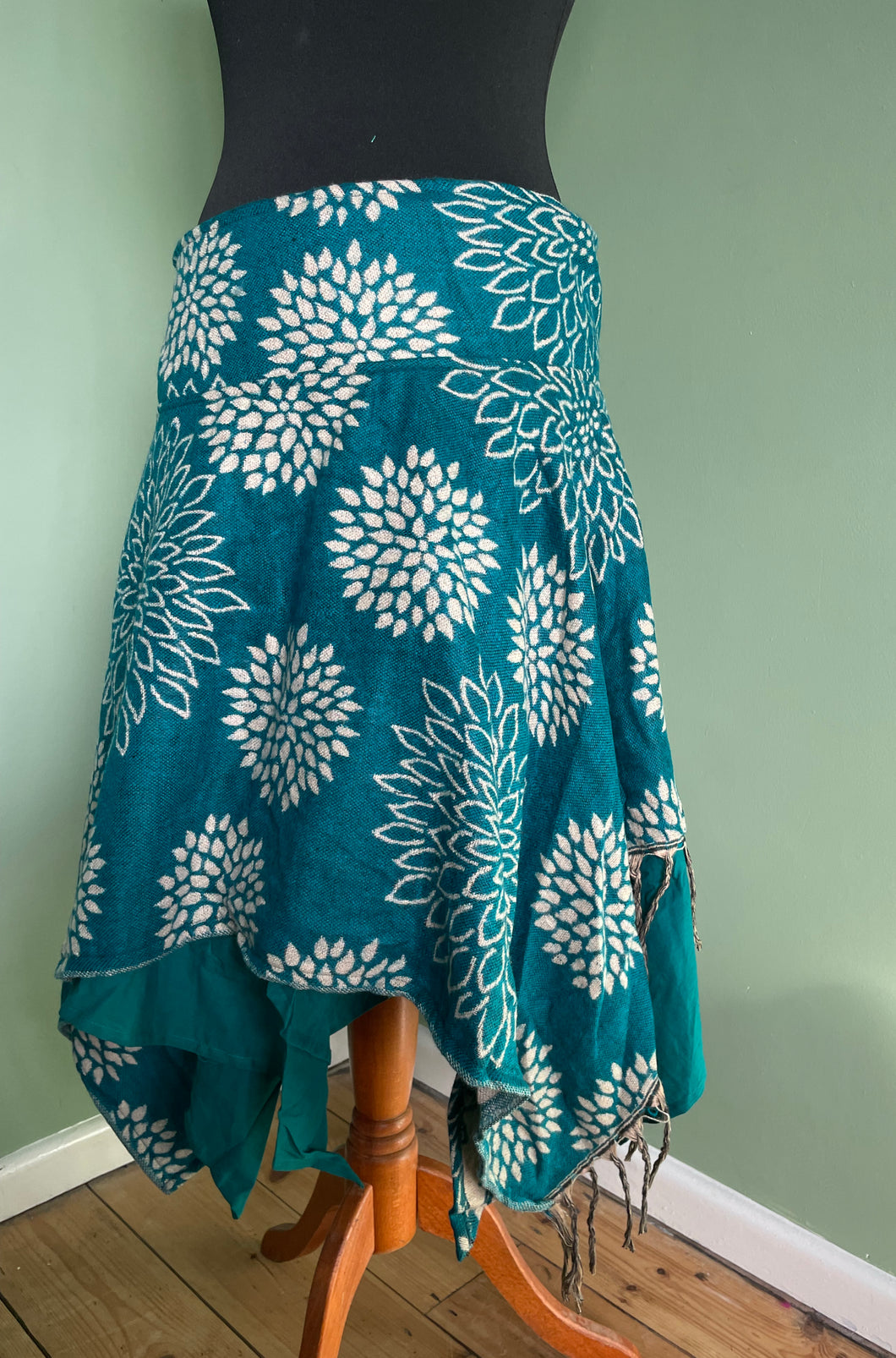 Buy now online from Emma's Emporium! Ethical slow happy festival fashion, women's clothing wholesale,. Warm winter fleece wrap fairy skirt, with cotton lining. Reversible, bold flower print. machine washable bold flower print design.