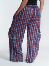 Load image into Gallery viewer, Buy now online at Emma's Emporium! Unisex Plaid Check Cargo Trousers. Experience comfort and style with these loose fit trousers in plaid cotton. Loose fit with an elastic waistband and lots of pockets, they offer a flattering, flexible fit and convenient relaxed style. Emma's Emporium ethical fashion, alternative women's clothing, festival hippie styles.