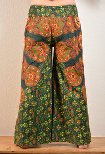 Summer Palazzo pants. Buy online from Emma's Emporium wholesale women's festival, alternative and hippie clothing. Colourful peacock print cotton  PALAZZO genie harem loose summer trousers. Shop now at Emma's Emporium UK clothing retail.