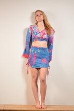 Load image into Gallery viewer, Emma's Emporium cotton lycra tie dye summer mini skirt, super colourful hippie tie dye asymmetric drawstring mini skirt, ideal for festival days and all night raves. Available to buy online from Emma's Emporium.