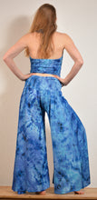 Load image into Gallery viewer, Summer Palazzo pants. Buy online from Emma's Emporium wholesale women's festival, alternative and hippie clothing. Multicoloured rainbow tie dye PALAZZO genie harem loose summer trousers. Shop now at Emma's Emporium UK clothing retail.