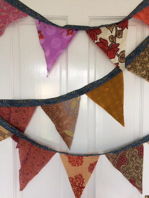 Recycled sari silk bunting, party, decoration. Buy now at Emma's Emporium, hippy ethnic fairtrade fashion, clothing, and gifts.