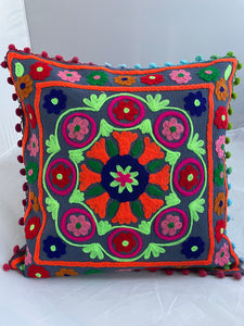 Available to buy online now from Emma's Emporium! Rainbow mandala embroidered Cushion Covers. Brightly coloured embroidery on a cotton background, with pom pom's. Extra large bold and eye catching cushion covers for a boho home. Visit Emma's Emporium for alternative women's clothing, festival fashion and hippy styles.