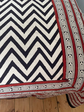 Load image into Gallery viewer, Emma's Emporium king size bedspread with a black chevron pattern on a natural unbleached heavy cotton background, displayed on a bed.