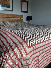 Load image into Gallery viewer, Emma's Emporium king size bedspread with a black chevron pattern on a natural unbleached heavy cotton background, displayed on a bed.