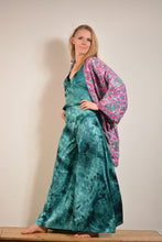 Load image into Gallery viewer, Emma&#39;s Emporium tie dye Palazzo trousers, extra wide leg flared hippy trousers with wide elastic waistband in bright vibrant tie dye. Made to ethical fair trade standards for Emma&#39;s Emporium slow fashion alternative women&#39;s festival clothing.
