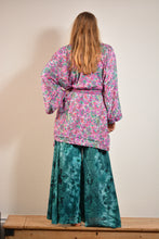 Load image into Gallery viewer, Emma&#39;s Emporium tie dye Palazzo trousers, extra wide leg flared hippy trousers with wide elastic waistband in bright vibrant tie dye. Made to ethical fair trade standards for Emma&#39;s Emporium slow fashion alternative women&#39;s festival clothing.
