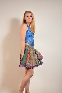 Emma's Emporium online! Shop our new collection now. Recycled sari patchwork mini skirt, with elastic waist and frill edging. Each skirt is unique, made from a mix of colourful patterned sari scraps - this is a zero waste skirt! 
