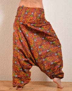 Emma's Emporium floral print cotton harem trousers. Available to buy online from Emma's Emporium clothing, gifts, accessories and jewellery. Emma's Emporium sells ethically sourced, unusual, festival inspired clothing. Hippy, summer, beach, hippie boho; ethical women's wear wholesale.