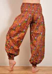 Buy now online, Emma's Emporium floral Genie trousers, lightweight cotton loose fit trousers in beautiful Indian floral print. Buy now from Emma's Emporium online store, ethical alternative women's fashion; hippie festival clothing and accessories, ethically sourced from India and South America. Shop online or find us at a festival. All clothing and products available for UK wholesale.