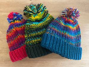 Buy now online from Emma's Emporium, Colourful Nepalese Rainbow Pompom Bobble Hat! Keep your head warm this winter! Pure wool hand knitted hats in vibrant rainbow colours. Made for Emma's Emporium with love by our friends in Kathmandu.