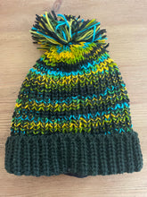 Load image into Gallery viewer, Buy now online from Emma&#39;s Emporium, Colourful Nepalese Rainbow Pompom Bobble Hat! Keep your head warm this winter! Pure wool hand knitted hats in vibrant rainbow colours. Made for Emma&#39;s Emporium with love by our friends in Kathmandu.
