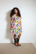 Load image into Gallery viewer, Emma&#39;s Emporium bold floral print summer beach dress, with elastic back and pockets. Colourful lightweight summer beach festival dress!
