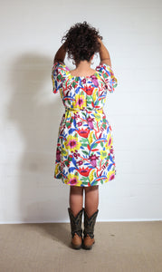 Emma's Emporium bold floral print summer beach dress, with elastic back and pockets. Colourful lightweight summer beach festival dress!