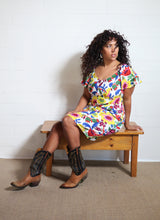 Load image into Gallery viewer, Emma&#39;s Emporium bold floral print summer beach dress, with elastic back and pockets. Colourful lightweight summer beach festival dress!
