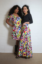Load image into Gallery viewer, Emma&#39;s Emporium bold floral print summer beach dress, with elastic back and pockets. Colourful lightweight summer beach festival dress!
