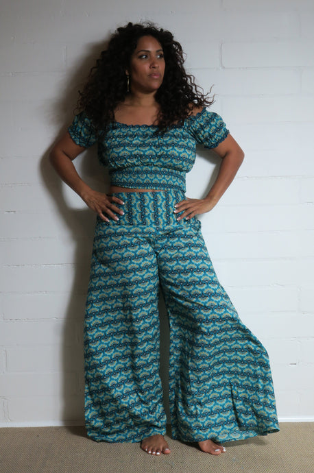 Emma's Emporium wide leg peacock print cotton palazzo flare trouser. Shope Emma's Emporium online, for retail and wholesale fair trade ethical women's alternative clothing, gifts and festival fashion. Hippy Hippie clothes, colourful and unique.