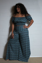 Load image into Gallery viewer, Emma&#39;s Emporium wide leg peacock print cotton palazzo flare trouser. Shope Emma&#39;s Emporium online, for retail and wholesale fair trade ethical women&#39;s alternative clothing, gifts and festival fashion. Hippy Hippie clothes, colourful and unique.
