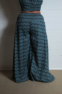 Emma's Emporium wide leg peacock print cotton palazzo flare trouser. Shope Emma's Emporium online, for retail and wholesale fair trade ethical women's alternative clothing, gifts and festival fashion. Hippy Hippie clothes, colourful and unique.