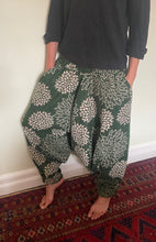 Load image into Gallery viewer, Emma&#39;s Emporium fleece genie harem trousers, loose fit warm winter  hippy pants, made from machine washable vegan fleece, in bright flower or paisley design. Slow fashion, ethically sourced hippie festival hippy fashion.
