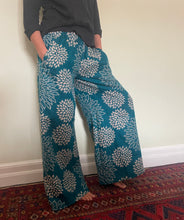 Load image into Gallery viewer, New In! Palazzo Pants! Emma&#39;s Emporium fleece genie harem trousers, loose fit warm winter  hippy pants, made from machine washable vegan fleece, in bright flower or paisley design. Slow fashion, ethically sourced hippie festival hippy fashion.
