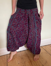 Load image into Gallery viewer, Emma&#39;s Emporium fleece genie harem trousers, loose fit warm winter  hippy pants, made from machine washable vegan fleece, in bright flower or paisley design. Slow fashion, ethically sourced hippie festival hippy fashion.
