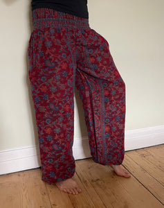 Emma's Emporium fleece genie harem trousers, loose fit warm winter  hippy pants, made from machine washable vegan fleece, in bright paisley design. Slow fashion, ethically sourced hippie festival hippy fashion.
