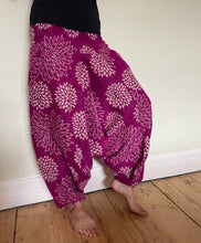 Load image into Gallery viewer, Emma&#39;s Emporium fleece genie harem trousers, loose fit warm winter  hippy pants, made from machine washable vegan fleece, in bright flower or paisley design. Slow fashion, ethically sourced hippie festival hippy fashion.
