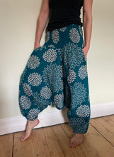 Load image into Gallery viewer, Emma&#39;s Emporium fleece genie harem trousers, loose fit warm winter  hippy pants, made from machine washable vegan fleece, in bright flower or paisley design. Slow fashion, ethically sourced hippie festival hippy fashion.
