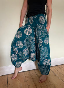 Emma's Emporium fleece genie harem trousers, loose fit warm winter  hippy pants, made from machine washable vegan fleece, in bright flower or paisley design. Slow fashion, ethically sourced hippie festival hippy fashion.