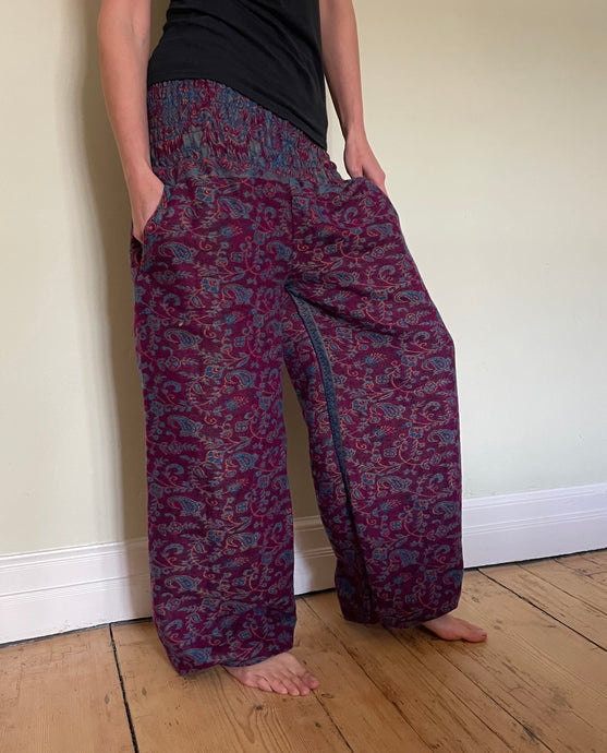 Emma's Emporium fleece genie harem trousers, loose fit warm winter  hippy pants, made from machine washable vegan fleece, in bright paisley design. Slow fashion, ethically sourced hippie festival hippy fashion.
