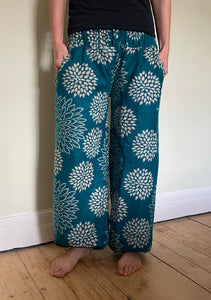Emma's Emporium fleece genie harem trousers, loose fit warm winter  hippy pants, made from machine washable vegan fleece, in bright floral magenta design.