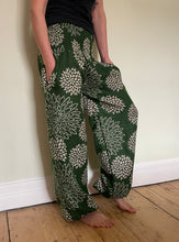 Load image into Gallery viewer, Emma&#39;s Emporium fleece genie harem trousers, loose fit warm winter  hippy pants, made from machine washable vegan fleece, in bright floral magenta design.
