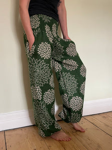 Emma's Emporium fleece genie harem trousers, loose fit warm winter  hippy pants, made from machine washable vegan fleece, in bright floral magenta design.