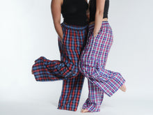 Load image into Gallery viewer, Buy now online at Emma's Emporium! Unisex Plaid Check Cargo Trousers. Experience comfort and style with these loose fit trousers in plaid cotton. Loose fit with an elastic waistband and lots of pockets, they offer a flattering, flexible fit and convenient relaxed style. Emma's Emporium ethical fashion, alternative women's clothing, festival hippie styles.
