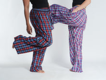 Load image into Gallery viewer, Buy now online at Emma's Emporium! Unisex Plaid Check Cargo Trousers. Experience comfort and style with these loose fit trousers in plaid cotton. Loose fit with an elastic waistband and lots of pockets, they offer a flattering, flexible fit and convenient relaxed style. Emma's Emporium ethical fashion, alternative women's clothing, festival hippie styles.
