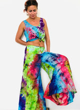 Load image into Gallery viewer, Emma&#39;s Emporium tie dye Palazzo trousers, extra wide leg flared hippy trousers with wide elastic waistband in bright vibrant tie dye. Made to ethical fair trade standards for Emma&#39;s Emporium slow fashion alternative women&#39;s festival clothing.
