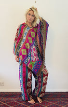 Load image into Gallery viewer, Colourful geometric fleecy warm hippie fair-trade poncho, with front pocket, unisex gender neutral clothing made from vegan wool.

