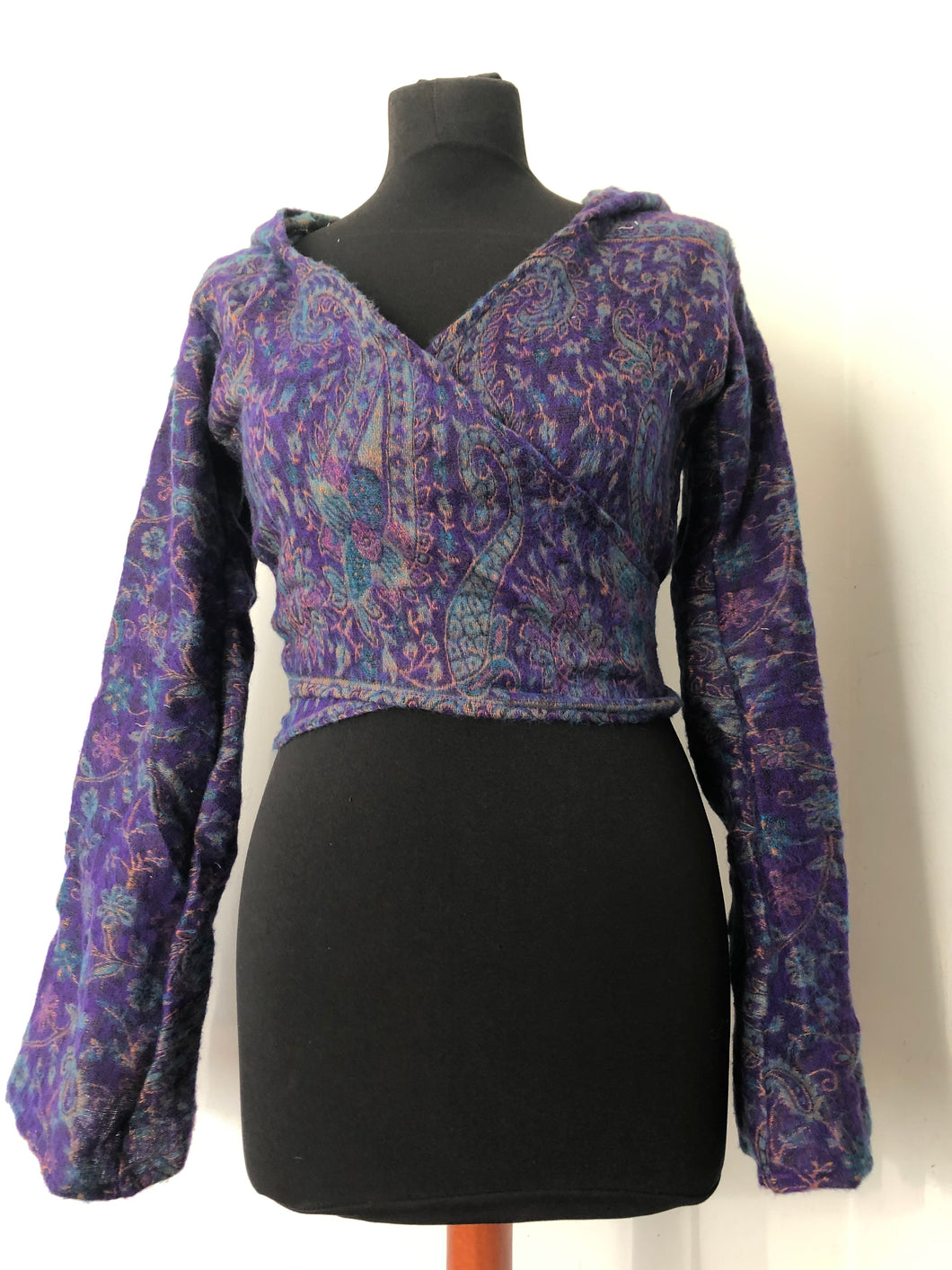 Emma's Emporium ethical global fashion. boho style pixie wrap top. Crop top cardi in paisley pattern with hood and trumpet sleeves.