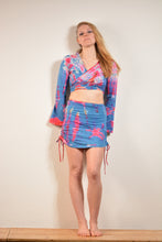 Load image into Gallery viewer, Emma&#39;s Emporium cotton lycra tie dye summer mini skirt, super colourful hippie tie dye asymmetric drawstring mini skirt, ideal for festival days and all night raves. Available to buy online from Emma&#39;s Emporium.
